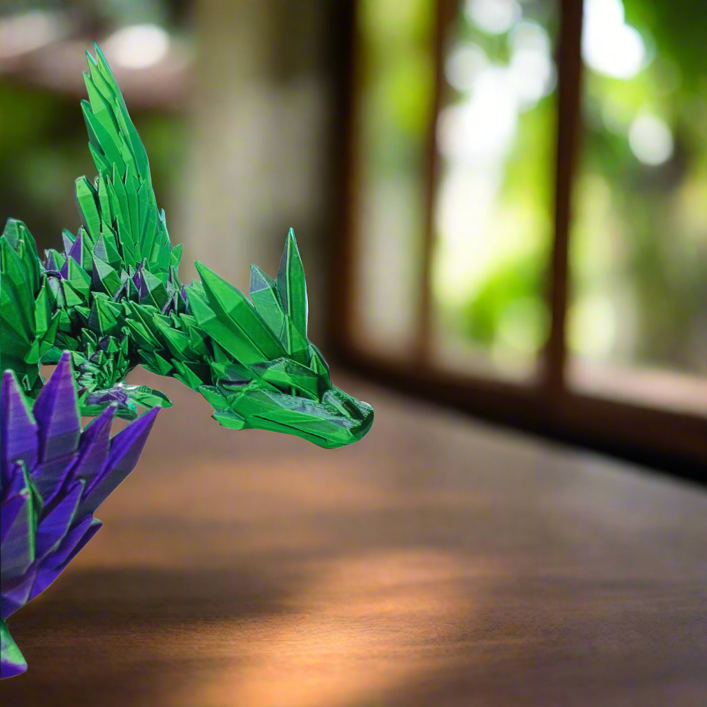 Front view of a 3D printed crystal-wing articulated dragon toy in purple and green silk, highlighting its detailed head and crystal-like wings, 20 inches long.