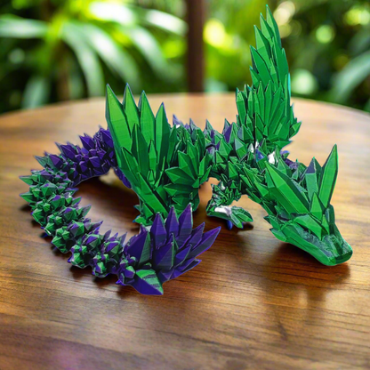 Side view of a 3D printed crystal-wing articulated dragon toy in purple and green silk colors, showcasing its crystal-like wings and flexible joints, 20 inches long.

