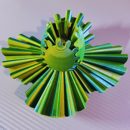 Close-up of the Gear Sphere 3D Printed Fidget Toy in an expanded position, highlighting the intricate green and blue gear mechanism. Perfect for stress relief, sensory stimulation, and focus enhancement.